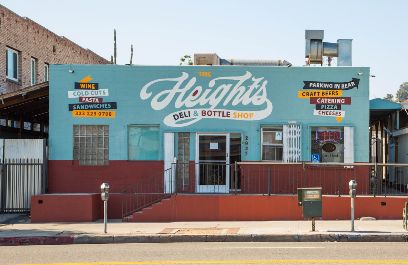 The Heights Deli and Bottle Shop teal storefront at 2927 N Broadway